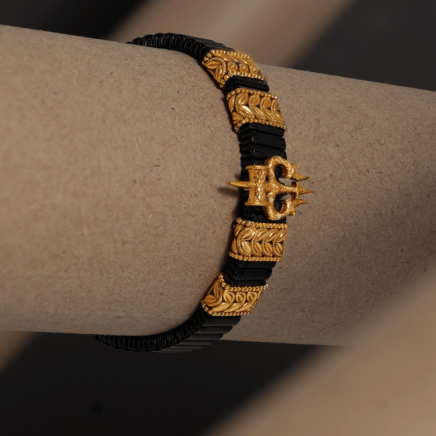 Shiv Trishul Elastic Kada in Antique Gold and Matte Black