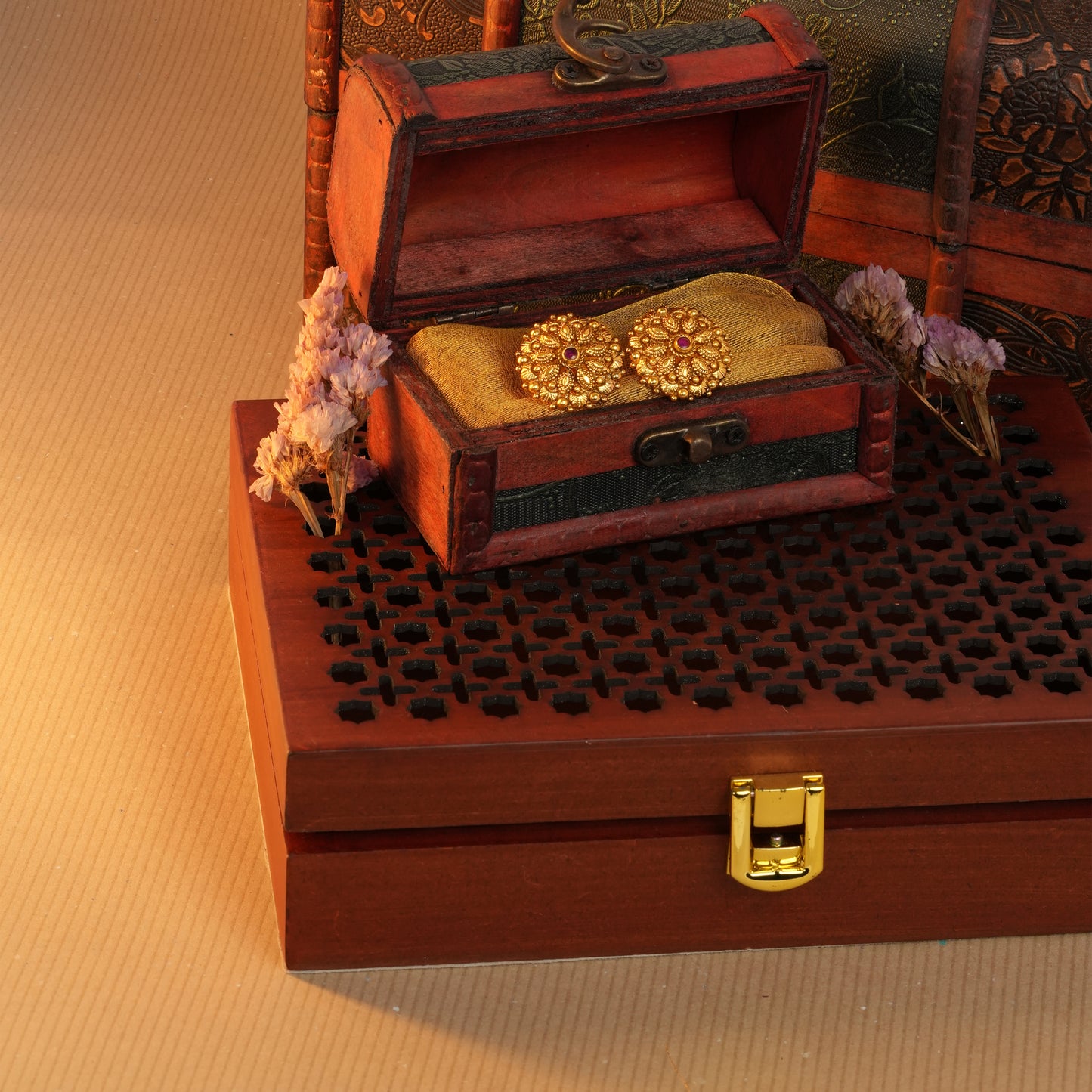 Antique Gold-Finish Pushpa Studs with Ruby Centre and Leaf Filigree