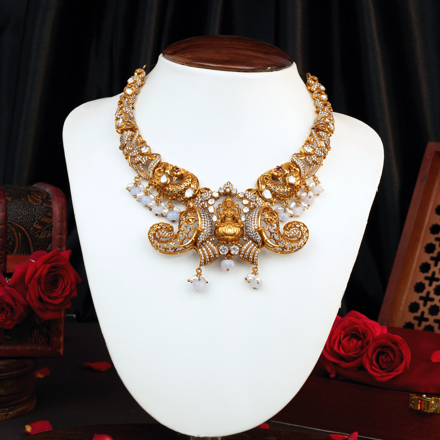 Majestic Victor Gold Necklace with Lakshmi Centerpiece, Intricate Elephants, and White Stone Accents