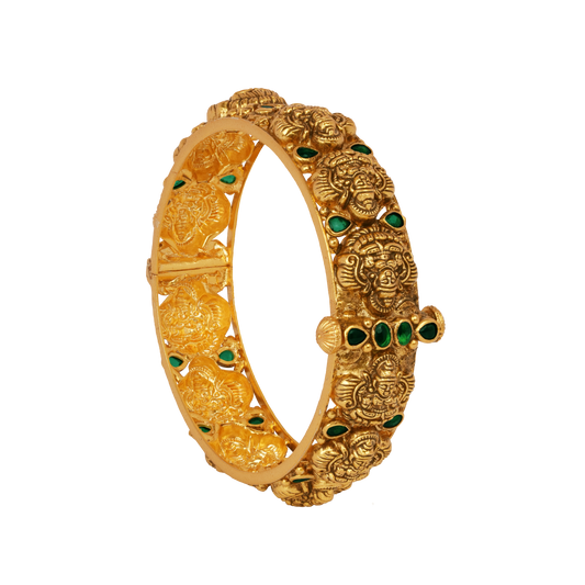 Temple Heritage Gold Bangle with Intricate Lion Motifs and Emerald Accents