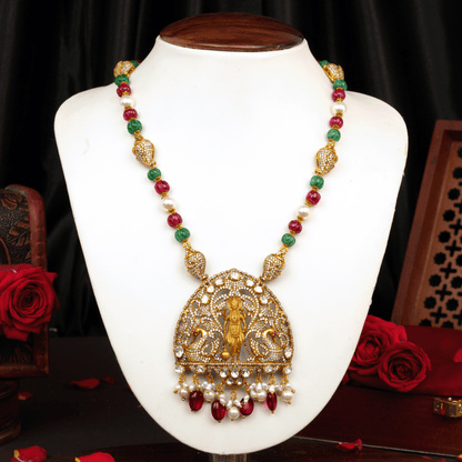 Graceful Victor Gold Haaram with Lakshmi Pendant, Ruby and Emerald Beads, and Pearl Accents