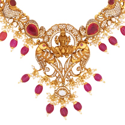 Ornate Victor Gold Necklace with Ruby Bead Drops, Lakshmi Pendant, and Intricate Peacock Motifs